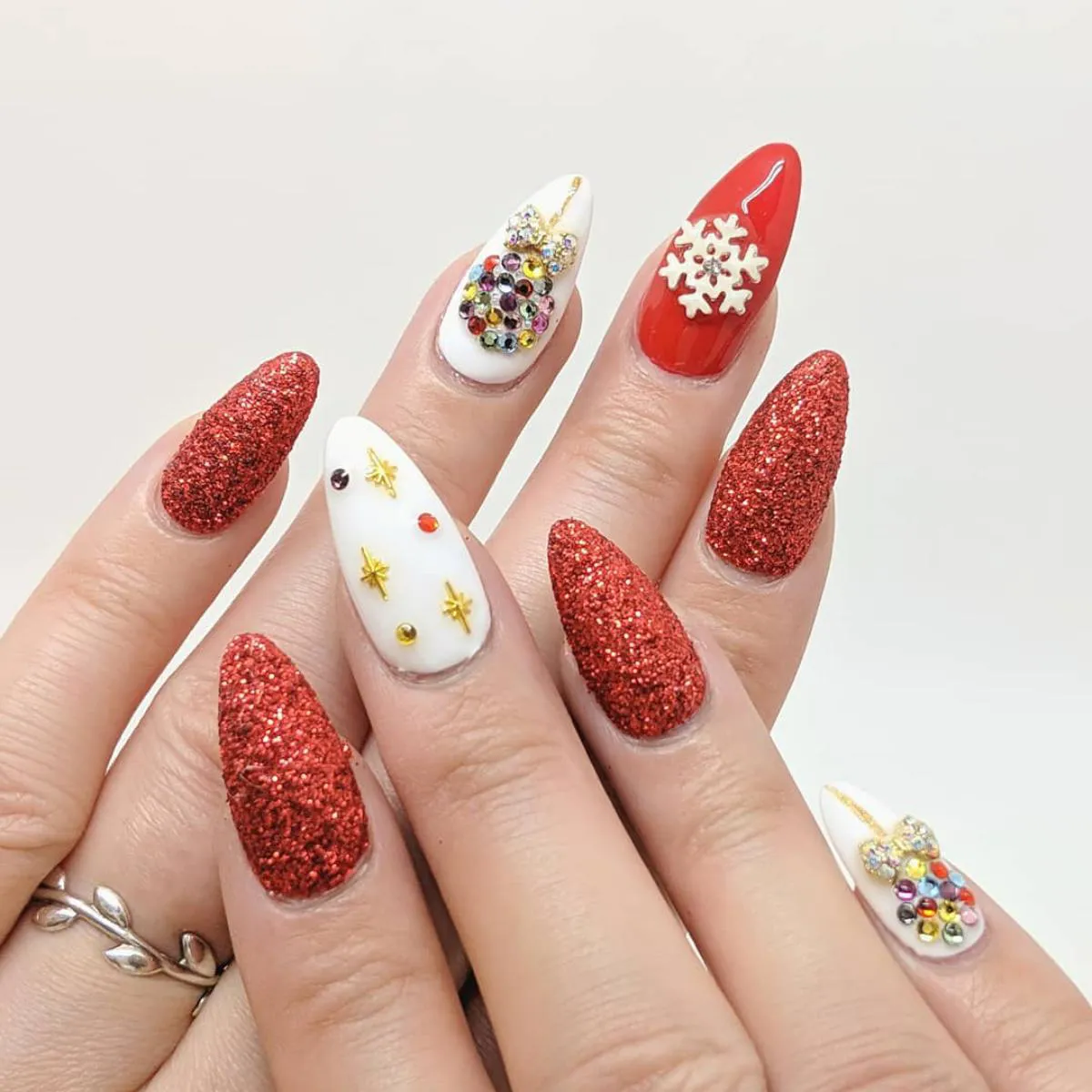 Red glitter nails with glossy depth
